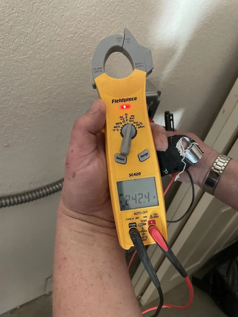 Voltage testing with clamp meter during Outlet Installation in Travelers Rest